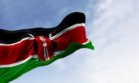National flag of Kenya waving on a clear day. Black, red, and green bands separated by white lines, with a black Masai shield on two spears in the center. 3d illustration render. Fluttering fabricの写真素材