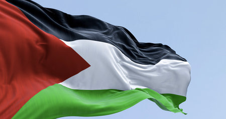 Palestine national flag waving on a clear day. Three black, white, green stripes with red triangle on left. 3d illustration render. Selective focus. Close-up. Rippling fabric. Selective focusの写真素材
