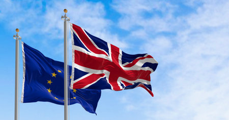 Flags of United Kingdom and the European Union waving in the wind. 3d illustration render. Selective...