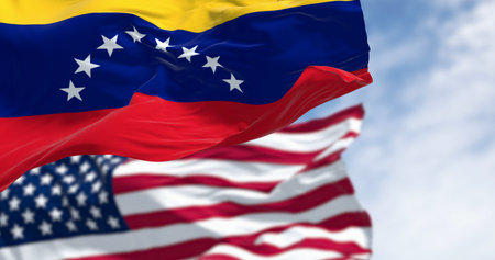 Venezuela and US national flags waving in the wind on a clear day. Diplomatic tension. 3d illustration render. Selective focusの写真素材