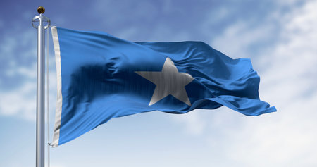 Somalia national flag waving. Light blue with white, five-pointed star at the center. 3D illustration render. Rippling fabric. Selective focusの写真素材