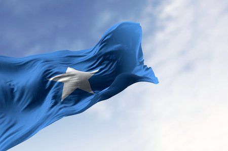 Somalia national flag waving. Light blue with white, five-pointed star at the center. 3D illustration render. Rippling fabric. Selective focusの写真素材