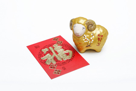 Chinese new year of goat with red packet of ang powの写真素材