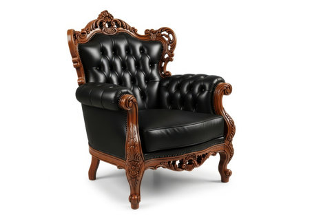 A luxurious, antique-style armchair upholstered in deep black tufted leather, featuring an intricately carved wooden frame and ornate detailing.の素材