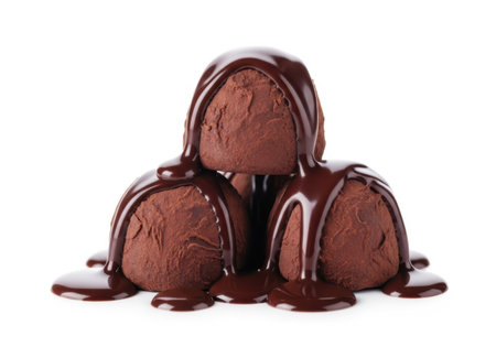 Three decadent scoops of dark chocolate ice cream are piled high and generously drizzled with melted dark chocolate sauce.の素材