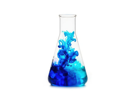 Laboratory flask with blue ink in water isolated on white background.の素材