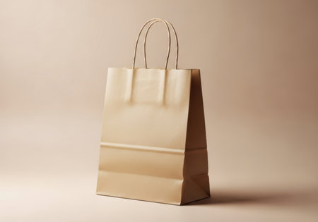 Brown paper bag on a beige background. Shallow depth of fieldの素材