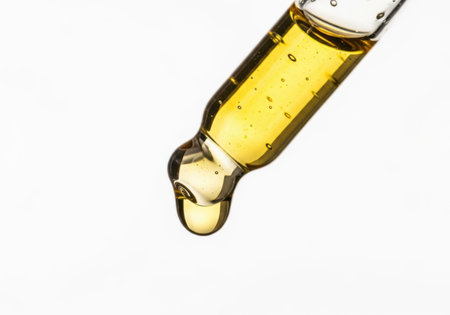 Oil dropper isolated on a white background. Close-up.の素材