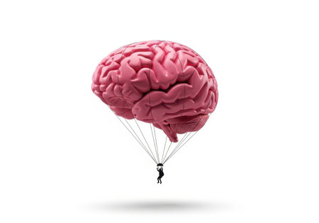 A detailed human brain is depicted as a parachute, with a small figure suspended below, descending against a stark white backdrop.の素材