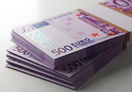 Fifty euro banknotes stack on white background. Shallow dof.の素材