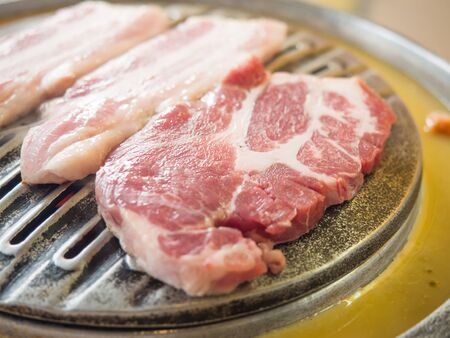 Raw bacon on the heat pan, Concept for roast or grill steak, Protein nutritionの写真素材