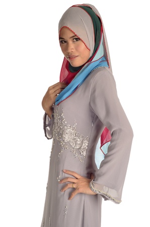 Young Muslim Ladywith colorful headscarf isolated in white background の写真素材