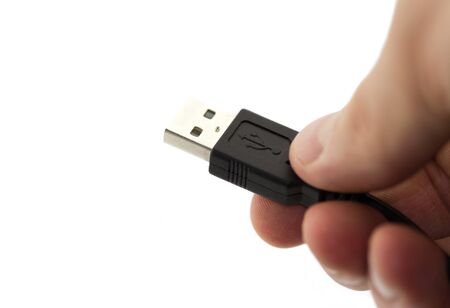 USB cable in hand isolated on white background