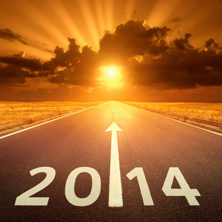 Driving on an empty asphalt road at sunset to new year