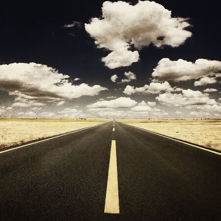Vintage photo. Driving on an empty highway at nice sunny dayの写真素材