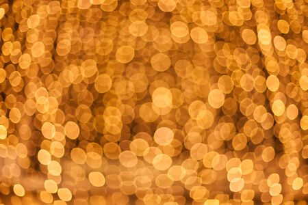 Golden abstract background with real bokeh - defocused decorated street lights