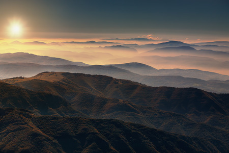 View from the mountain Stara Planina in Serbia at idyllic sunrise above the clouds.の写真素材