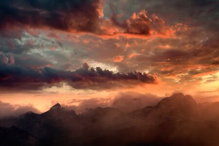 Fiery sunset over the mountain peaks with dramatic cloud formation.
National Park Durmitor - Montenegro.