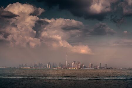 Skyscrapers of Dubai downtown with Burj Kalifa highest building on the world in center at unique cloudy dayの写真素材