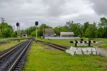 Railway tracks and dead end on grassの写真素材