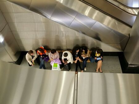 People sitting on the subway station