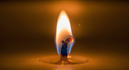 A close-up of a candle flame with a warm glow, set against a dark background, creating a sense of...