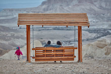 Mitzpe Ramon, 01 December 2016: Couple on swings at Mitzpe Ramonのeditorial素材