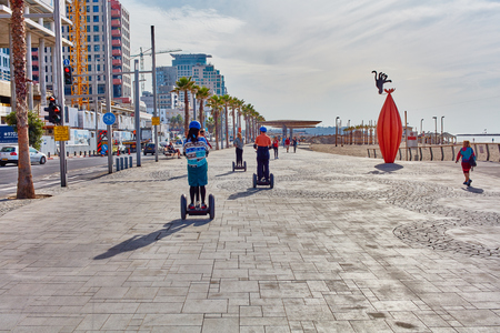 Tel-Aviv - 4 December, 2016: Tourists on a segway tour at the Tel-Aviv beachのeditorial素材