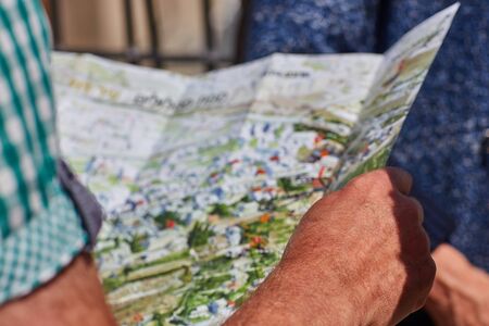 Elderly man holds a map of Jerusalemの写真素材