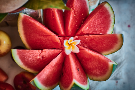 Beautiful sliced fruits arranged with blurred backgroundの写真素材