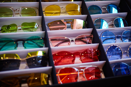Vintage colorful sunglasses on a displayの写真素材