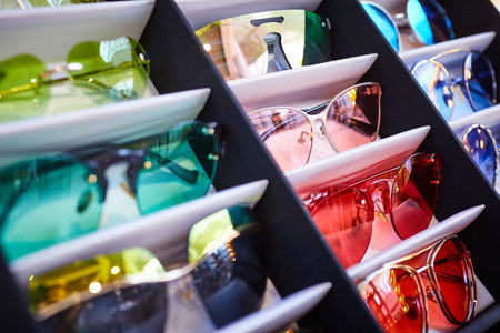 Vintage colorful sunglasses on a displayの写真素材