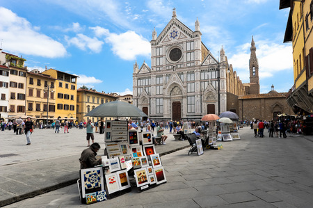 FLORENCE  June 2 2013  The facade of the Basilica of Santa Croce in Florence during the day with lateral peddlers.のeditorial素材