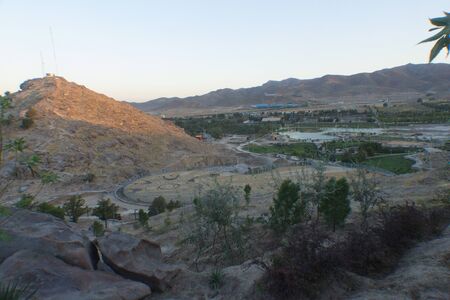 Mashhad Iran   August 30 2014: Aerial view of the Holy City of Mashhad and the shrine of Imam Reza Show some high buildings And some mountains and high plateaus and terrain to the city.のeditorial素材