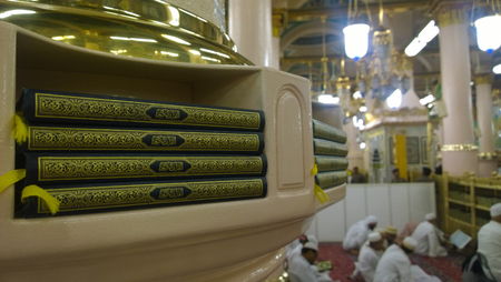 Image for rack contains a number of copies of the Koran inside the Prophet's Mosque in Medina in Saudi Arabia.のeditorial素材
