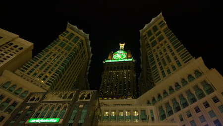 Picture of Makkah Clock Tower, It is a tower containing the hotels overlooking the Kaaba and at its peak clock and panel containing Koranic verses written on every minute change.のeditorial素材