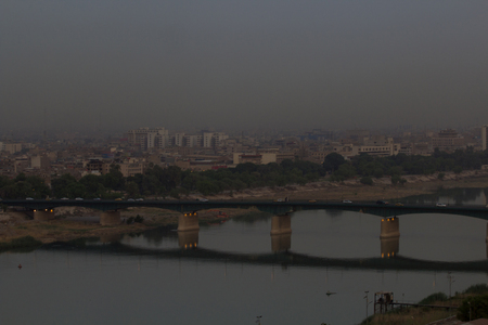 Aerial photo of the city of Baghdad, and shows where residential complexes and the Tigris River and bridges. The city of Baghdad, capital of Iraq.のeditorial素材