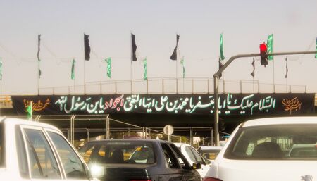 picture of a street in the Iranian city of Teheran, and some passing cars.のeditorial素材