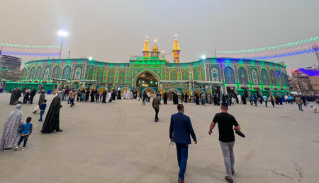 Karblaa, Iraq - 10, Mar 2022: picture for imam Mahdi holy Makkam in Karblaa city in Iraq , and showing one dome
 and  many of visitiors  walking beside the shrine , and lovely lights night.のeditorial素材