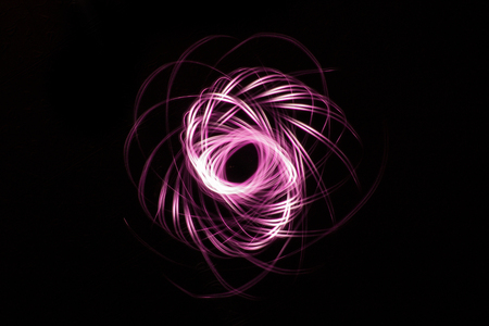 Bright glowing abstract line is photographed on a long exposureの写真素材