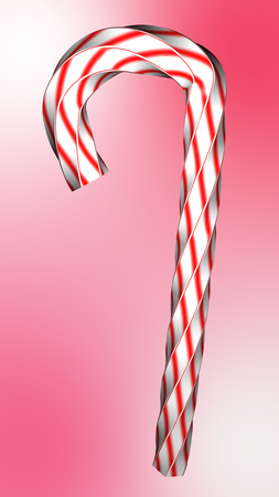 Red white swirled candy on isolate background.の写真素材