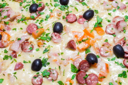 Appetizing delicious pizza with olives black olives close-up.の写真素材