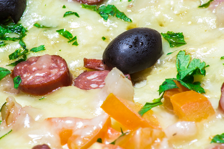 Appetizing delicious pizza with olives black olives close-up.の写真素材