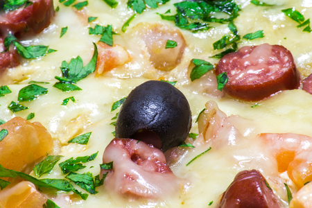 Appetizing delicious pizza with olives black olives close-up.の写真素材