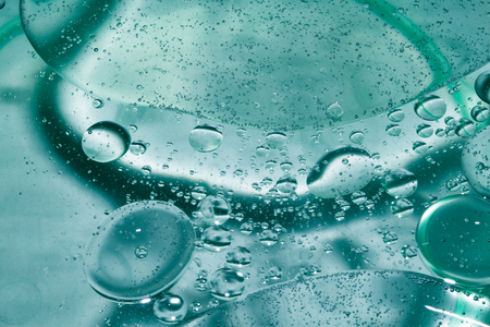 Misted glass, blue and purple rain drops dew drops on colorful abstract cool color background...