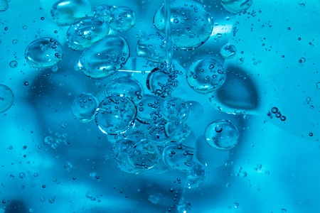 Misted glass, blue and purple rain drops dew drops on colorful abstract cool color background...