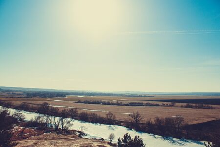 Beautiful landscape, sunny spring day view of the field, clear sky.の写真素材