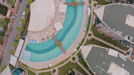 Top view of the territory of an expensive hotel. Spa resort Swimming pool. Aerial drone view Luxury...