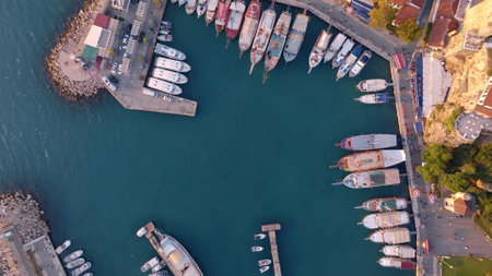 Aerial view of amazing boats. Marina bay. Top view from drone of harbor with yacht, motorboat and sailboat. Seascape. High quality photoの写真素材