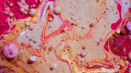Bright colorful red bubbles on the surface of the water. Abstract paint bubbles